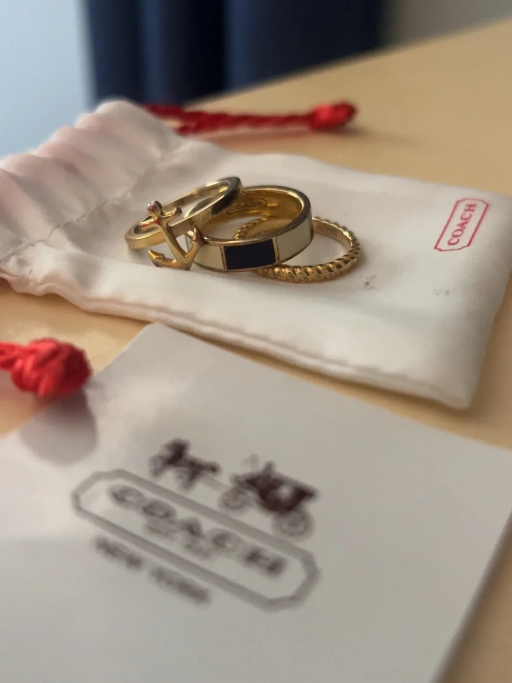 Coach Stackable Ring Trio with Gold Anchor, Rope, and Navy and Cream Inlay bands